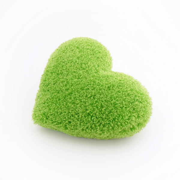 Side view of a Bright Green curly shag heart shaped decorative throw  pillow.