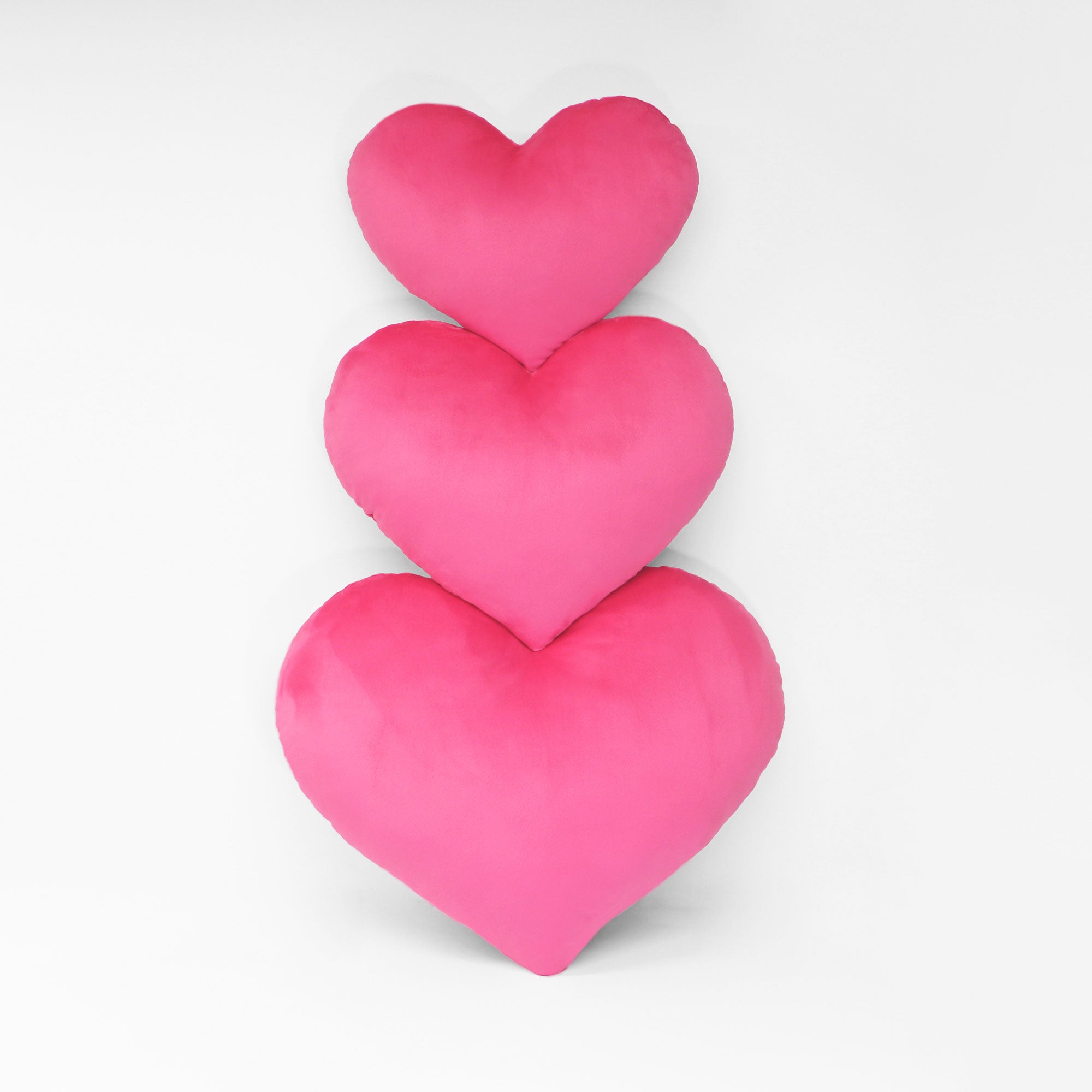 Example of heart pillows in three sizes. Shown in Hot Pink.