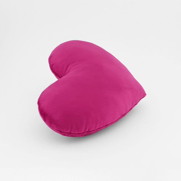 Side view of a Magenta plush heart shaped decorative throw pillow.