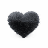 Front view of a Black faux fur heart shaped decorative pillow.