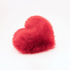 Side view of the Crimson red faux fur Heart shaped decorative pillow.
