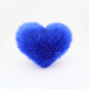 Front view of a Cobalt Blue faux fur heart shaped decorative pillow.
