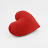 Side view of a Crimson Red plush heart shaped decorative throw pillow.