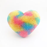 Second view of a Fluffy Rainbow colored heart shaped decorative pillow.
