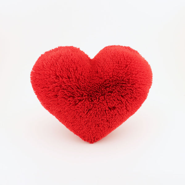 Front view of a Red fluffy plush heart shaped decorative pillow.