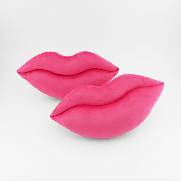 A pair of Hot Pink lips shaped decorative throw pillows.