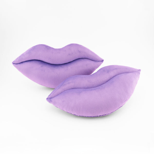 A pair of Lavender lips shaped decorative throw pillows.