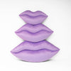 Lavender lips shaped pillows shown in three sizes.