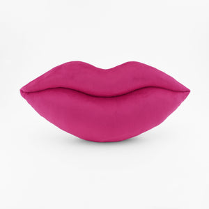 A Magenta lips shaped decorative throw pillow.