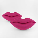 Another pair of Magenta colored lips shaped decorative throw pillows.