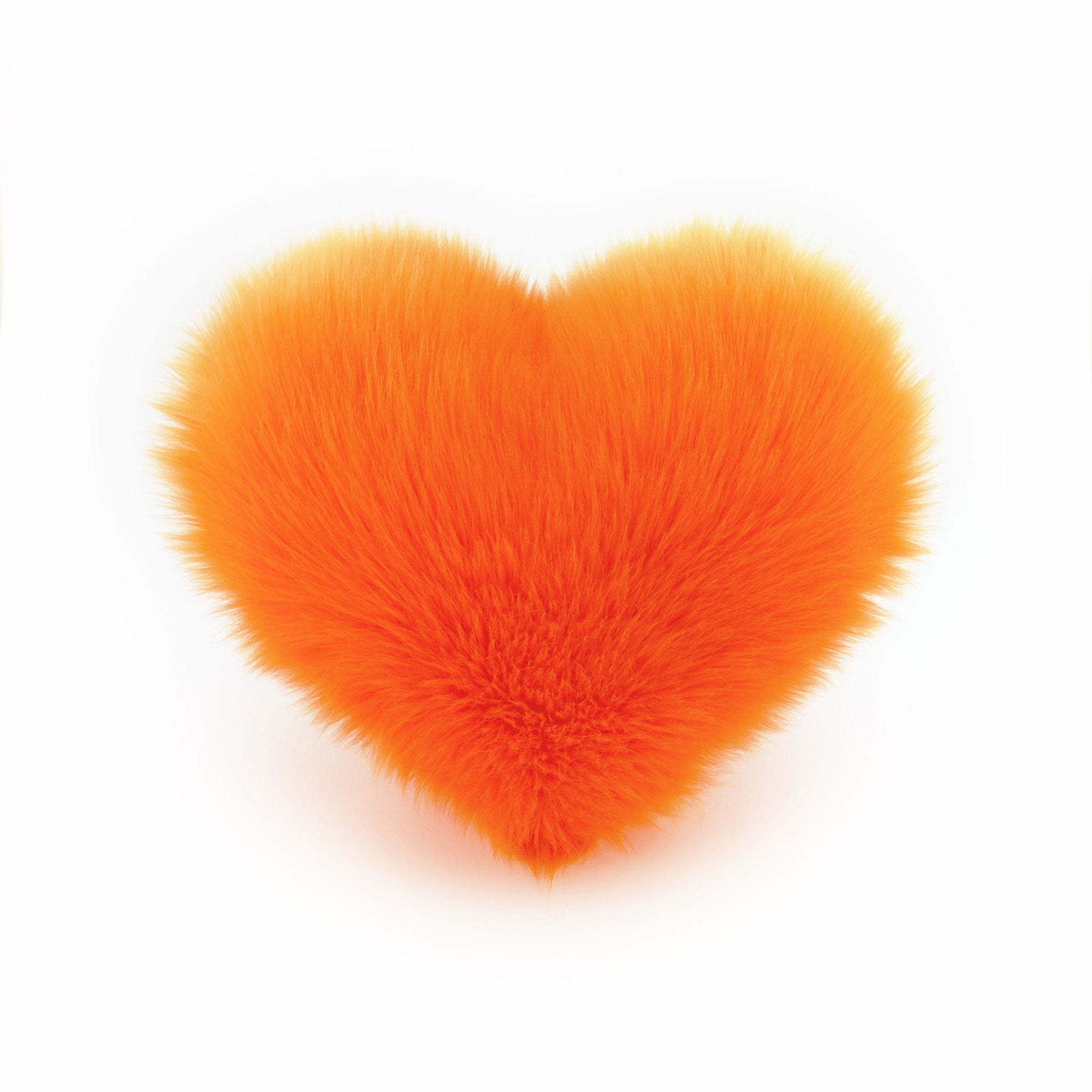 Orange faux fur heart shaped decorative throw pillow.