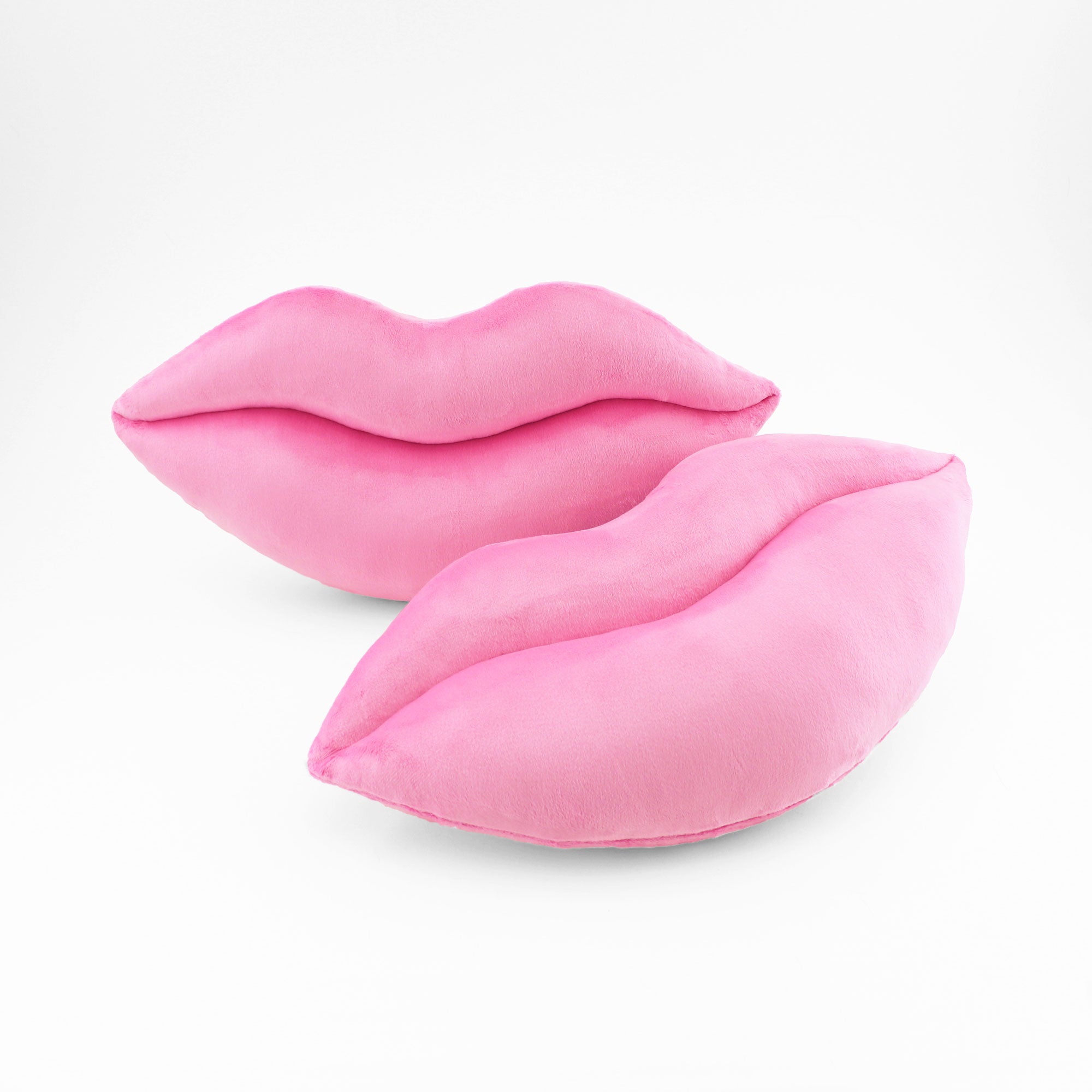 A pair of Bubble Gum Pink lips shaped decorative pillows.