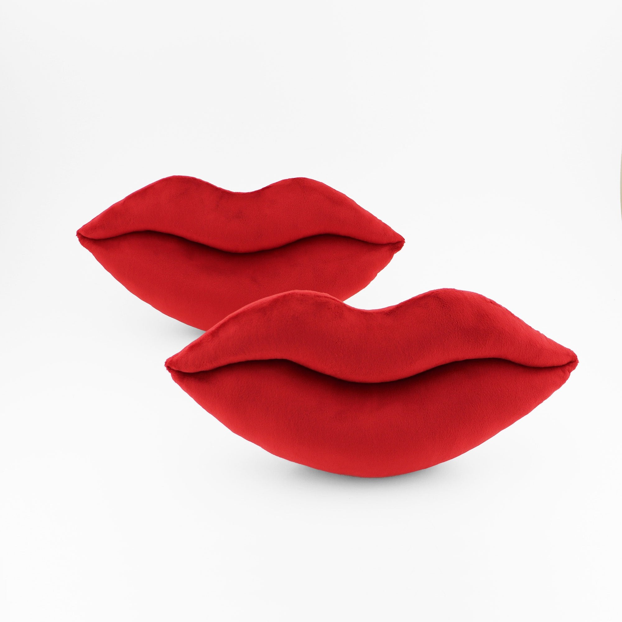 Another pair of crimson red lips shaped decorative pillows.