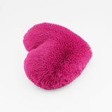Side view of the Magenta Heart shaped decorative pillow in fluffy shag material.