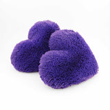 A pair of Purple fluffy shag heart shaped decorative pillows.